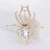 Three vintage crystal spider brooches, silver, gold and black alloy pins, Muslim-style white display stand Specification image